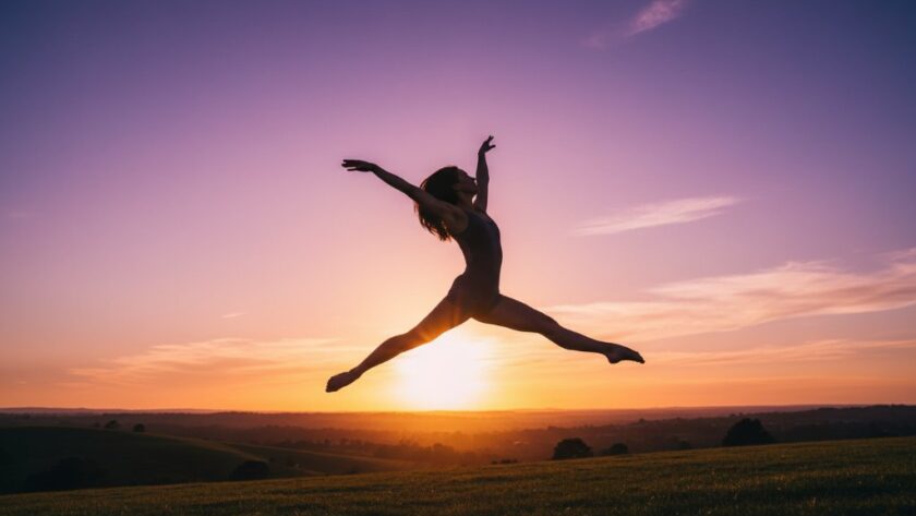 An ethereal and dynamic dance photography Herne Hill studios shot of a ballet dancer mid-air, silhouetted against a dramatic sunset over Herne Hill's rolling hills, capturing an epic leap with artistic flair.