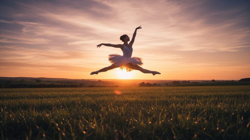 A Leongatha ballet dancer mid-leap at golden hour, silhouetted against a panoramic rural landscape, capturing the dynamic dance photography Leongatha capturing emotion with dramatic backlighting and a powerful, graceful pose.