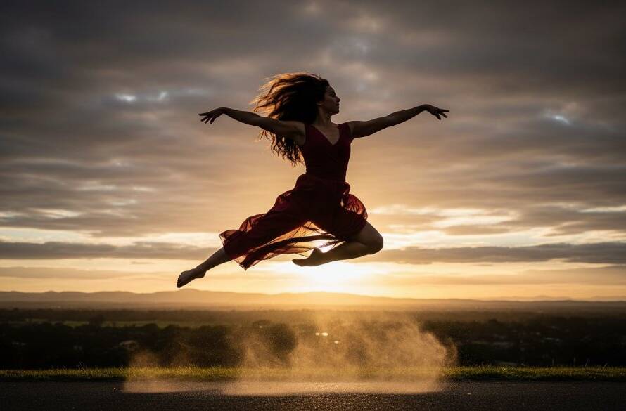 A stunning high-energy image capturing a dancer mid-air in a powerful leap, showcasing dynamic dance photography sessions Bayswater North Victoria, with dramatic studio lighting illuminating their movement and expression.