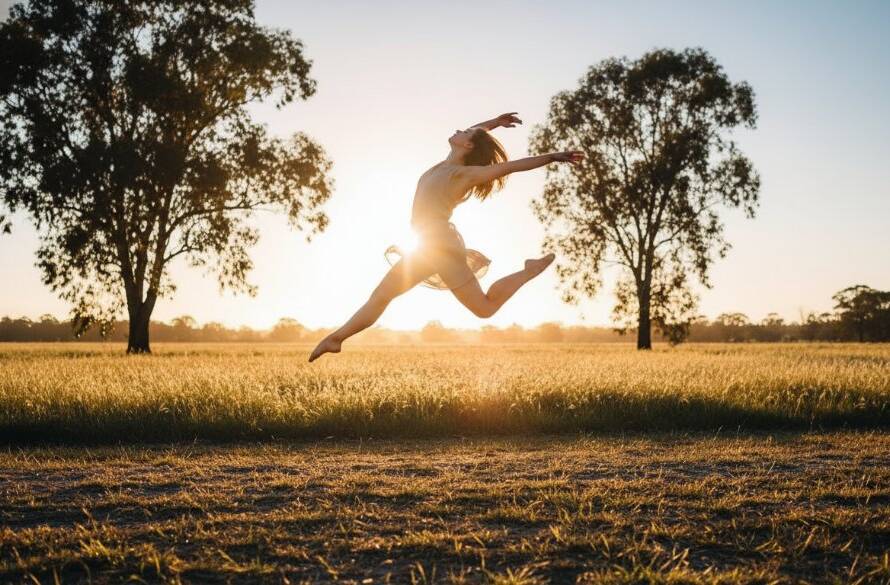 An epic moment of dynamic youth dance photography in Melton West, featuring a young dancer mid-leap against a dramatic, sunset-lit backdrop near the Western Freeway, showcasing incredible athleticism and grace.