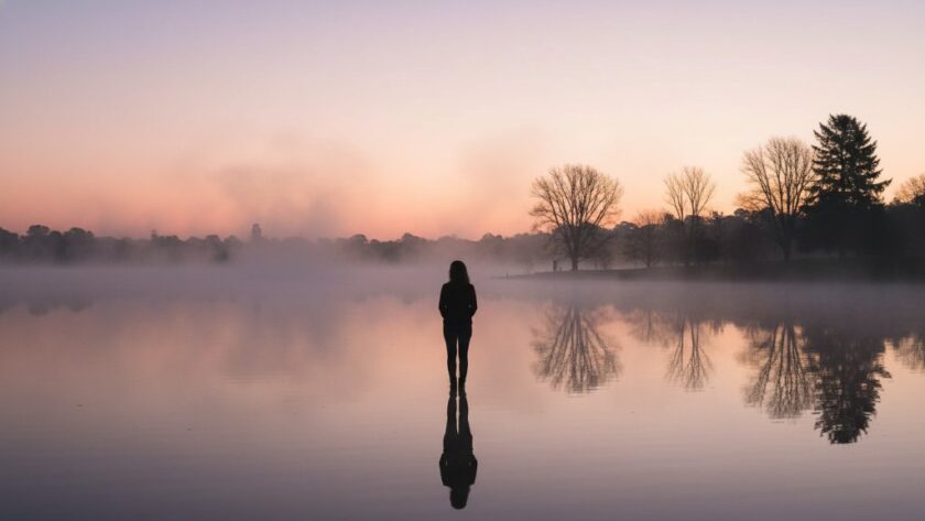 An emotionally resonant, wide-angle fine art photograph capturing a couple's silhouette against a dramatic sunset over Lake Wendouree, embodying the beauty of elevated Wendouree memories fine art photography, with professional colour grading.