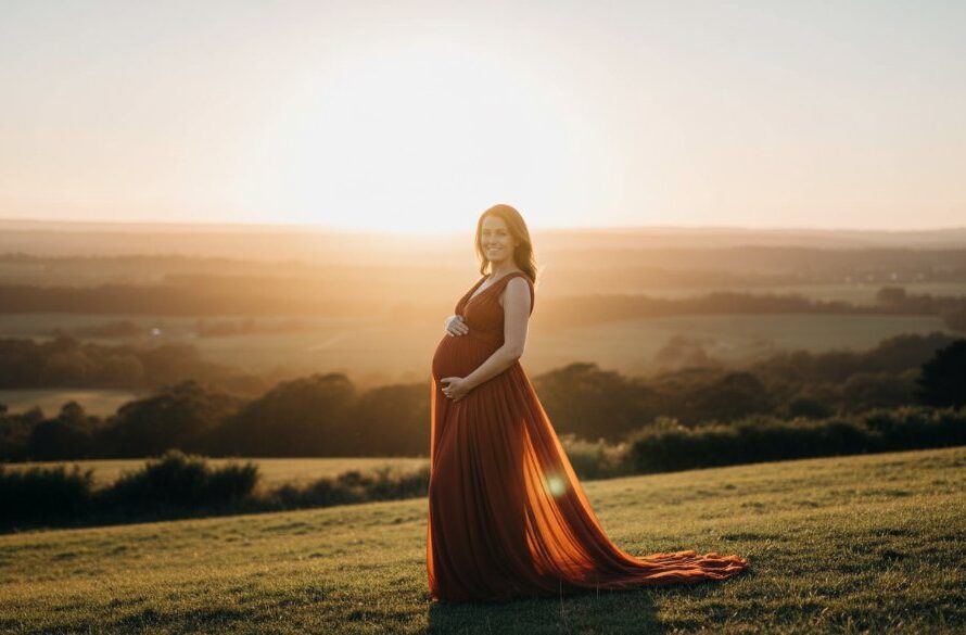 A stunning, professionally lit photograph capturing an expectant mother in an enchanting Mount Helen Victoria outdoor maternity photography session, bathed in golden hour light with a flowing gown, set against the serene landscape.