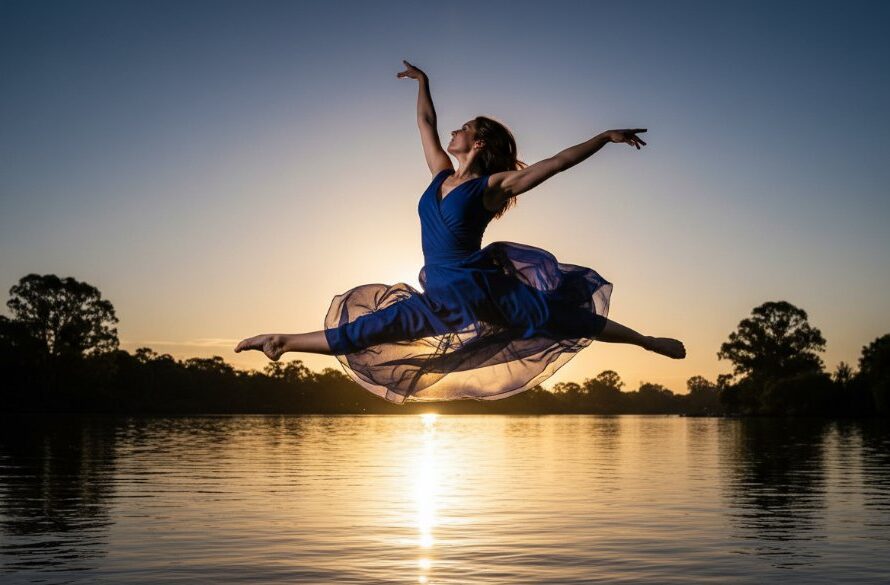 An epic moment of expressive contemporary dance photography Mooroopna, featuring a dancer mid-leap against a dramatic sunset sky over the Goulburn River, capturing raw emotion and dynamic movement with professional lighting and colour grading.