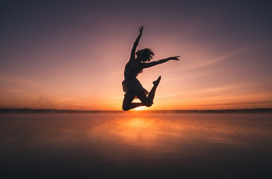 A stunning, dramatically lit epic moment capture of a contemporary dancer mid-leap against a misty Colac Victoria backdrop, embodying expressive dance portraits Colac Victoria with grace and power.