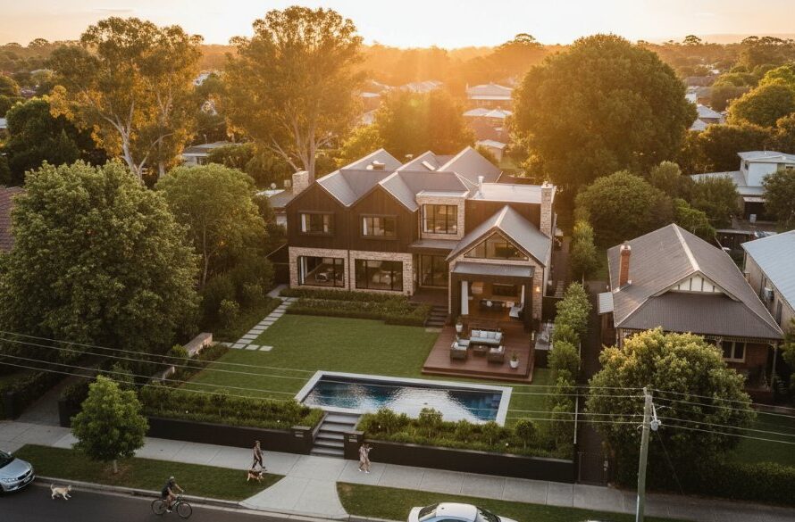 Dramatic aerial photograph captured by drone, showcasing a modern architectural property in Geelong West, Victoria, bathed in golden hour light, highlighting its unique features and expansive gardens from a breathtaking perspective. This Geelong West drone photography for properties shot exemplifies an epic moment.