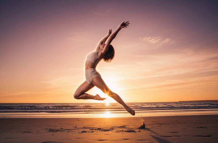 Dynamic wide shot of a ballet dancer mid-leap at sunset on the Hampton East foreshore, showcasing graceful form and the vibrant energy of Hampton East dance photography capture movement, with golden light illuminating her silhouette against a blurred coastal backdrop.