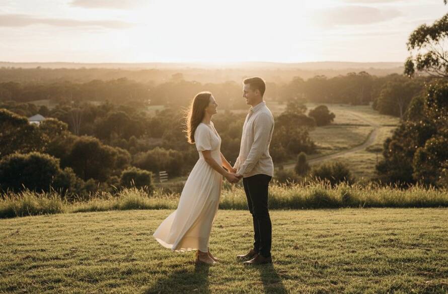 A couple embracing under dramatic sunset lighting in Heathmont, showcasing an epic moment in their pre-wedding photography romantic photoshoot Victoria.