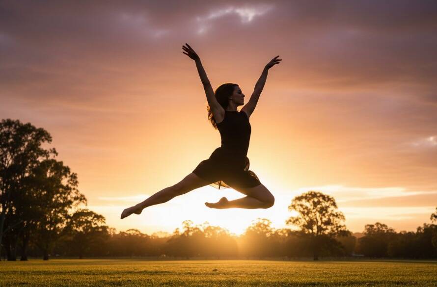 An epic moment captured in Heathmont Victoria dynamic dance photography, featuring a female dancer mid-air in a powerful, graceful leap against a soft-focus backdrop of Heathmont's leafy parks at sunset, dramatic backlighting highlighting her form and movement.