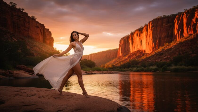 A dramatic and intimate boudoir photoshoot in Red Cliffs Victoria, featuring a woman silhouetted against a golden hour desert landscape, exuding confidence and elegance, professionally captured.