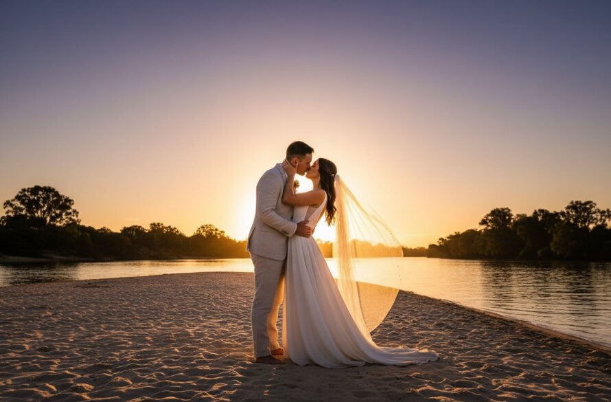 An epic moment of a newlywed couple embracing passionately under the golden hour light by the Murray River, captured through Intimate Merbein Riverside Wedding Photography Victoria, showcasing the stunning natural beauty of the region.