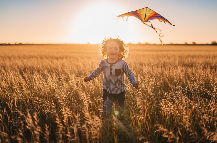A wide shot of a child, mid-laugh, running through a sun-drenched field near Lucas, Victoria, with a golden sunset illuminating their joyful expression, perfectly capturing an authentic, epic moment for joyful child portraits Lucas Victoria.