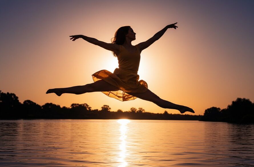 An epic moment in Kialla vibrant dance photography for portfolios, featuring a dancer mid-leap against a sunset backdrop near the Goulburn River, showcasing strength and grace.