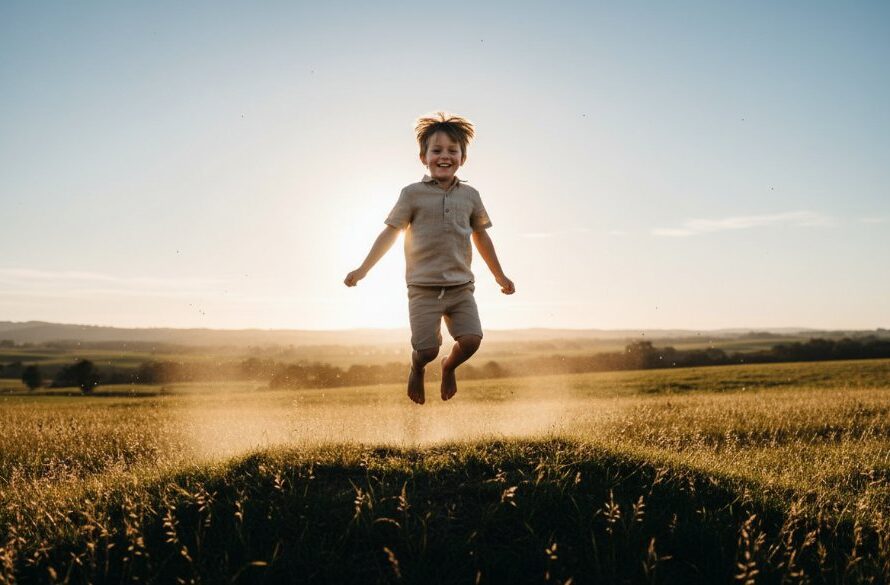 A professional, cinematic photograph capturing a child's genuine childhood joy during a Korumburra kids photography session, with the child laughing freely in a sun-dappled Korumburra park, autumn leaves swirling around them, showcasing the magic of an epic moment.