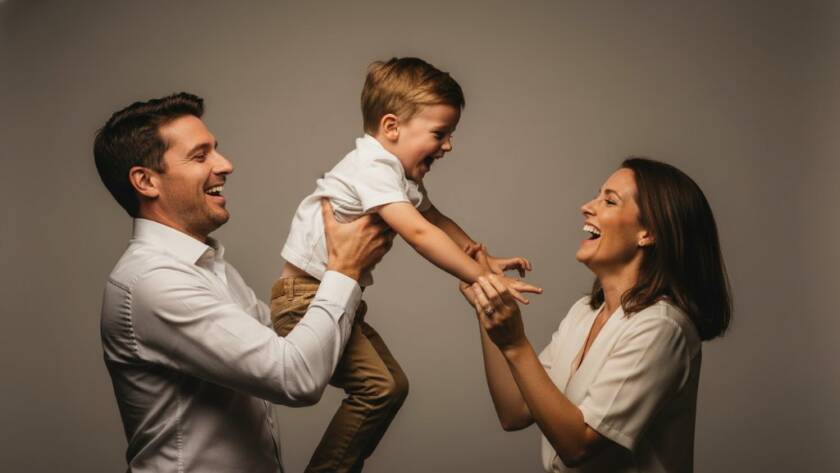 A heartwarming and dynamic Langwarrin bespoke studio photography experience moment, featuring a family laughing joyously as their young child reaches up playfully, illuminated by soft, cinematic studio lighting, with a dramatic shallow depth of field.