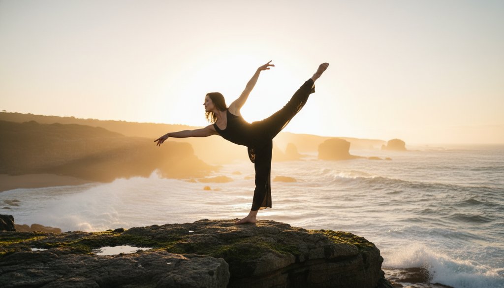 An exquisite dancer in mid-leap, silhouetted against a dramatic sunset over Mallacoota's rugged coastline, embodying the elegance of Mallacoota dance photography capturing coastal elegance.