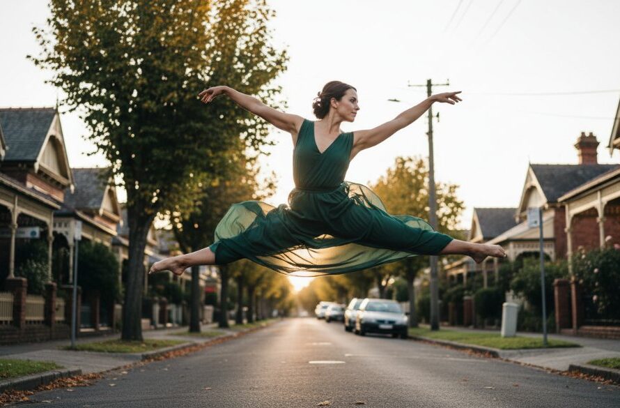 A breathtaking shot of a contemporary dancer in mid-leap, silhouetted against a dramatic sunset over the classic architecture of Manifold Heights, showcasing Manifold Heights dynamic dance photography in an epic moment of grace and power.