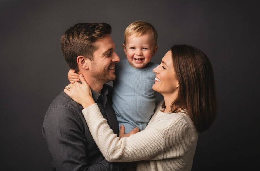 An epic, professionally colour-graded studio portrait showcasing a family from Melton South joyfully embracing and laughing, capturing their cherished connection through bespoke studio photography, with dramatic lighting and a clean backdrop.