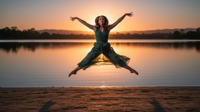 An exquisite Mount Clear dance photography emotional storytelling moment, featuring a dancer mid-leap at sunset over Lake Esmond, bathed in dramatic golden light, evoking powerful emotion and grace.