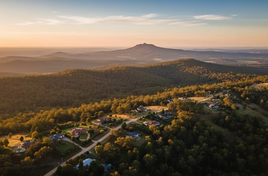 An epic drone shot showcasing the stunning landscapes of Mount Helen, Victoria, with golden hour light illuminating the iconic greenery and distant hills, captured through professional Mount Helen Drone Photography stunning landscapes.