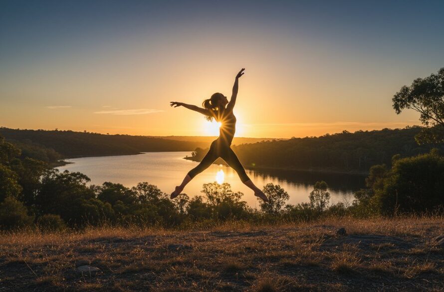 Dynamic wide shot capturing a female contemporary dancer in mid-air, silhouetted against a golden Newborough sunset, showcasing breathtaking Newborough contemporary dance photography with dramatic flair and powerful emotion.