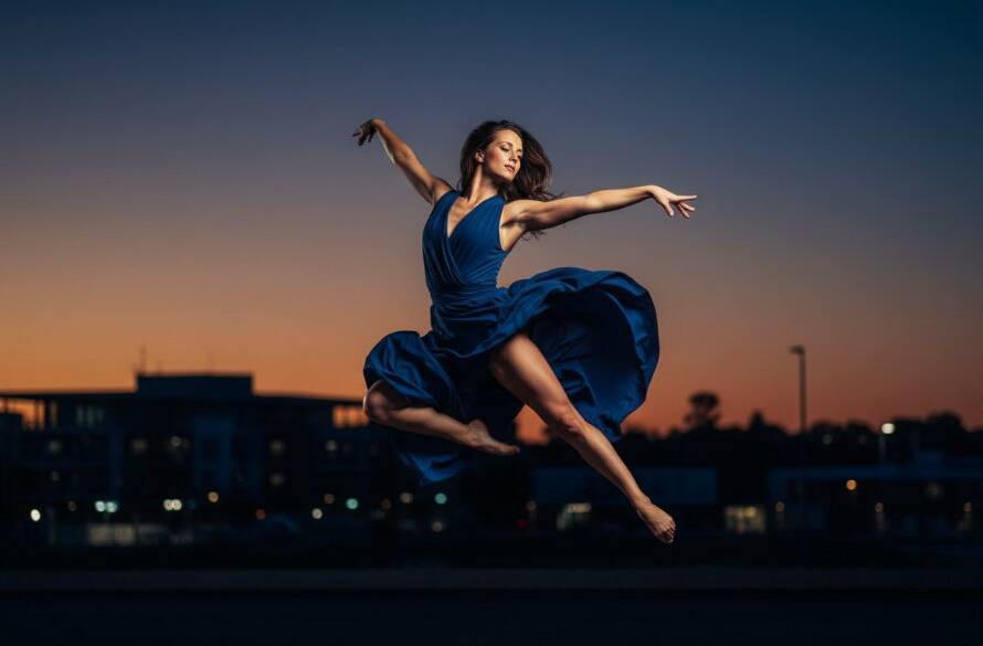 A breathtaking, professionally captured Oakleigh East dance photography dynamic shots showing a dancer mid-leap against a softly blurred, vibrant backdrop, bathed in dramatic stage lighting, evoking raw power and grace.