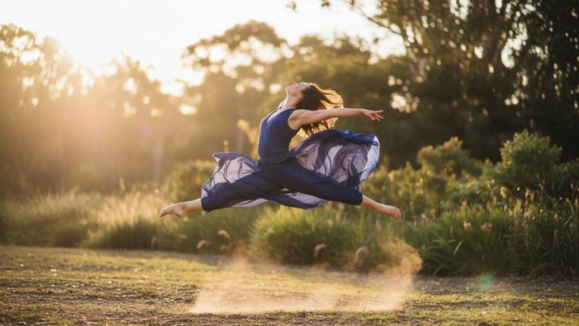 An epic moment in Park Orchards dance photography: capturing vibrant artistic expression, featuring a female dancer mid-air, silhouetted against a golden hour sunset over leafy Park Orchards landscape, displaying incredible power and grace.
