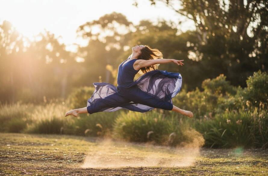 An epic moment in Park Orchards dance photography: capturing vibrant artistic expression, featuring a female dancer mid-air, silhouetted against a golden hour sunset over leafy Park Orchards landscape, displaying incredible power and grace.