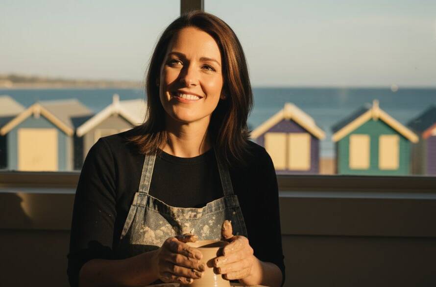 A vibrant, professional colour-graded image of a creative entrepreneur confidently working in a stylish Brighton setting, showcasing the power of professional branding photography Brighton VIC for creatives.