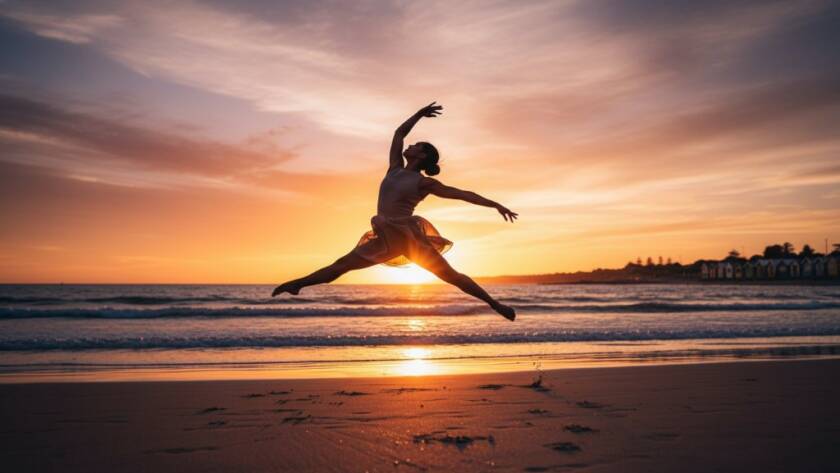 An exquisite professional contemporary dance photography Mentone beach sunset shot, featuring a dancer mid-leap against a golden Mentone beach backdrop, dramatically lit by the setting sun, capturing an epic moment of grace and power.