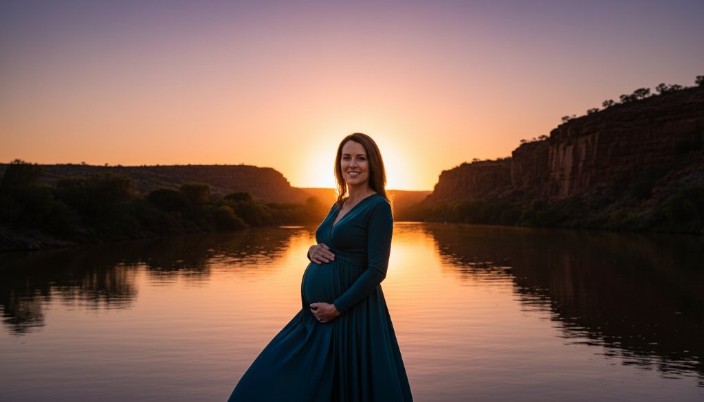 An ethereal portrait showcasing Red Cliffs Maternity Photography capturing glowing mum-to-be, set against a dramatic sunset over the Murray River, with the expectant mother silhouetted beautifully, embodying strength and anticipation.