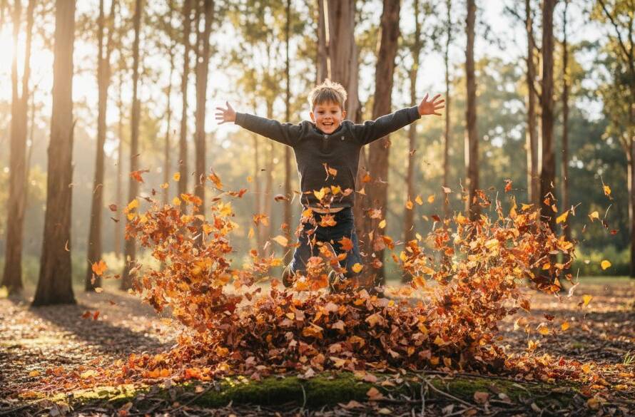 A professional photograph of a young child, around 5 years old, laughing joyfully as they run through a field of golden sun-drenched grass at Lysterfield Park, Rowville, with their parents' hands visible gently guiding them from behind, bathed in dramatic golden hour light, capturing Rowville family photography capturing authentic child joy.