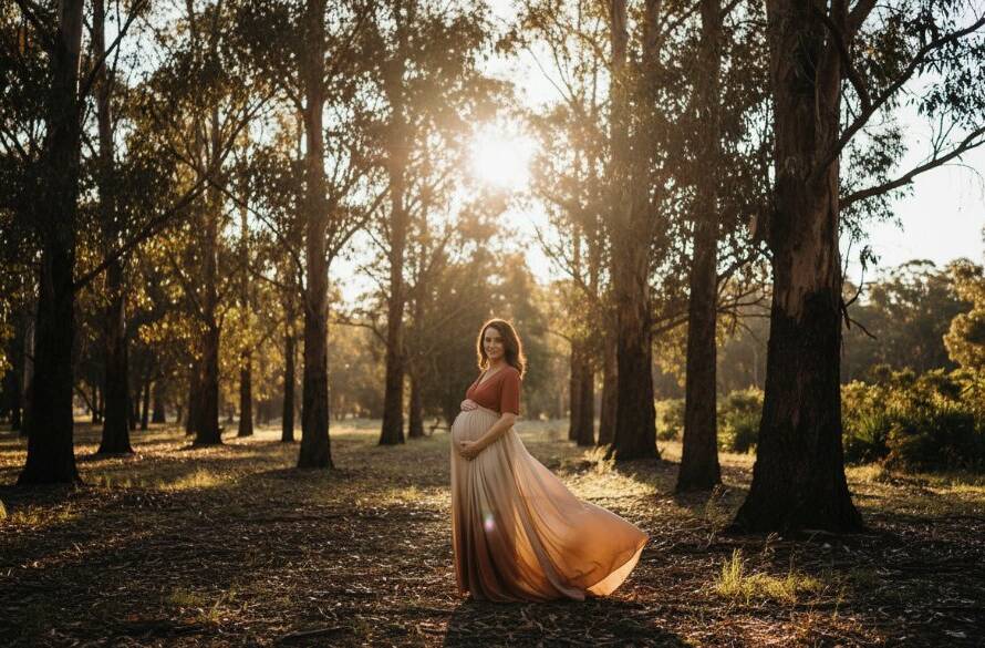 A glowing expectant mother embracing her bump during a serene Park Orchards maternity photoshoot, bathed in golden hour light amidst a peaceful bushland setting, captured with professional depth and warmth.