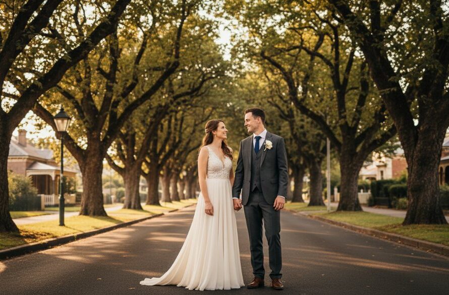 A stunning, wide-angle photograph capturing a newly married couple embracing romantically in the golden hour light, with the historic Victorian architecture of Soldiers Hill in the background, symbolizing exceptional Soldiers Hill intimate wedding photography Victoria.