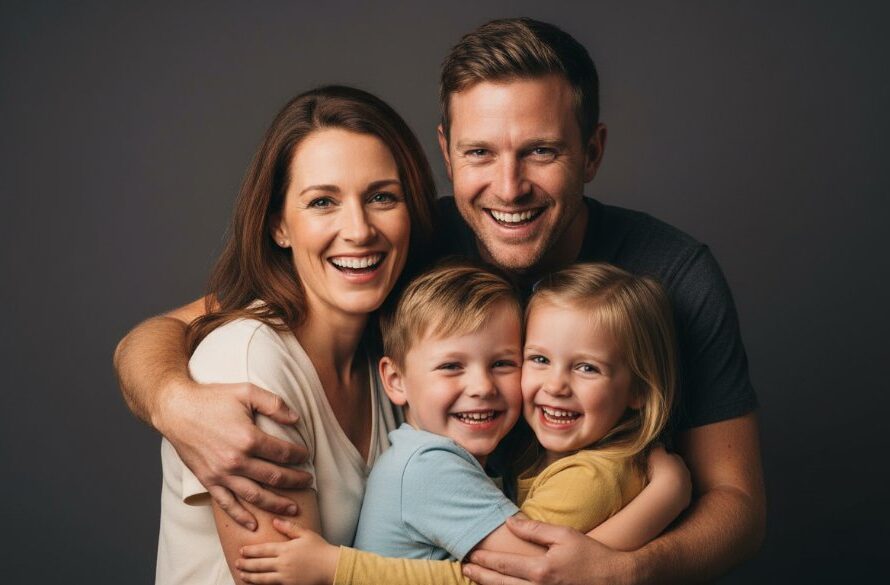 A stunning, professionally colour-graded cinematic photograph showcasing a heartwarming family portrait session in a modern studio. The family, radiating joy, is captured in an 'epic moment' of connection, illuminated by dramatic, soft studio lighting. This image represents tailored studio photography Benalla Victoria, emphasizing genuine emotions.
