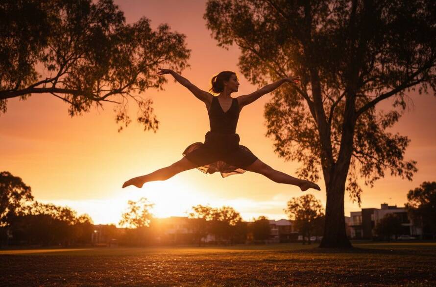 A dramatic 'epic moment' photograph showcasing vibrant Ashburton dance photography capturing expressive movement, with a dancer in mid-air, bathed in golden hour light against a modern Ashburton architectural backdrop.