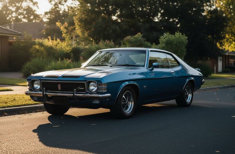 Dramatic shot of a polished vintage muscle car under golden hour light on a quiet street in Box Hill North, Victoria, highlighting its classic lines during a professional vintage auto photoshoot.