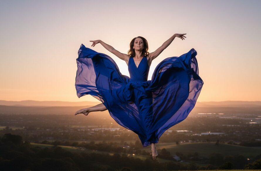 A dynamic and emotionally charged photograph capturing a dancer mid-air in an epic leap, silhouetted against a dramatic sunset over Waurn Ponds, showcasing Waurn Ponds vibrant dance photography for epic moments.
