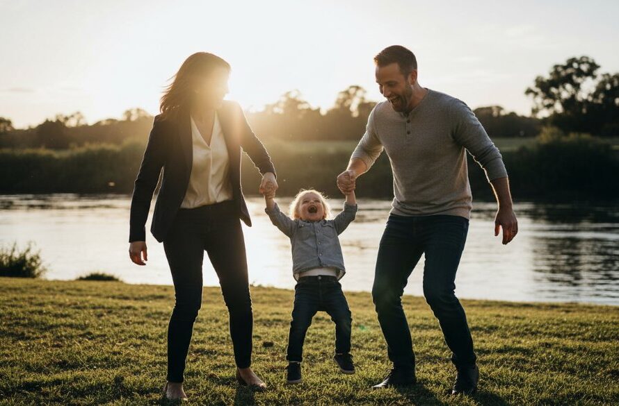 A heartwarming and authentic candid family moment captured in Wodonga, showing genuine laughter as parents play with their child by the Murray River, bathed in golden hour light, perfect example of Wodonga Candid Photography Authentic Family Moments.