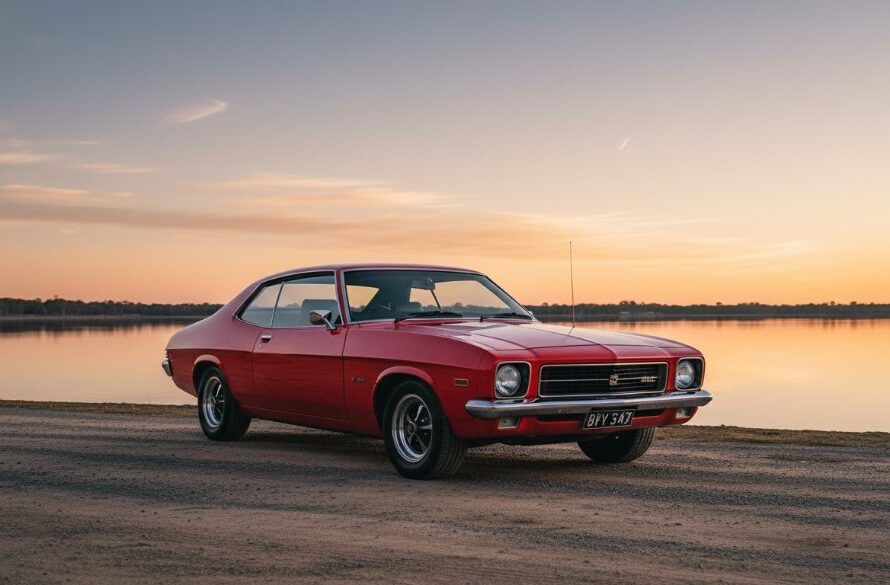 A vintage muscle car, gleaming in the golden hour, parked beside Lake Mulwala with the Yarrawonga sunset reflecting on its polished chrome, captured by Yarrawonga Automotive Photography capturing iconic lakeside moments. The scene evokes a sense of timeless adventure.